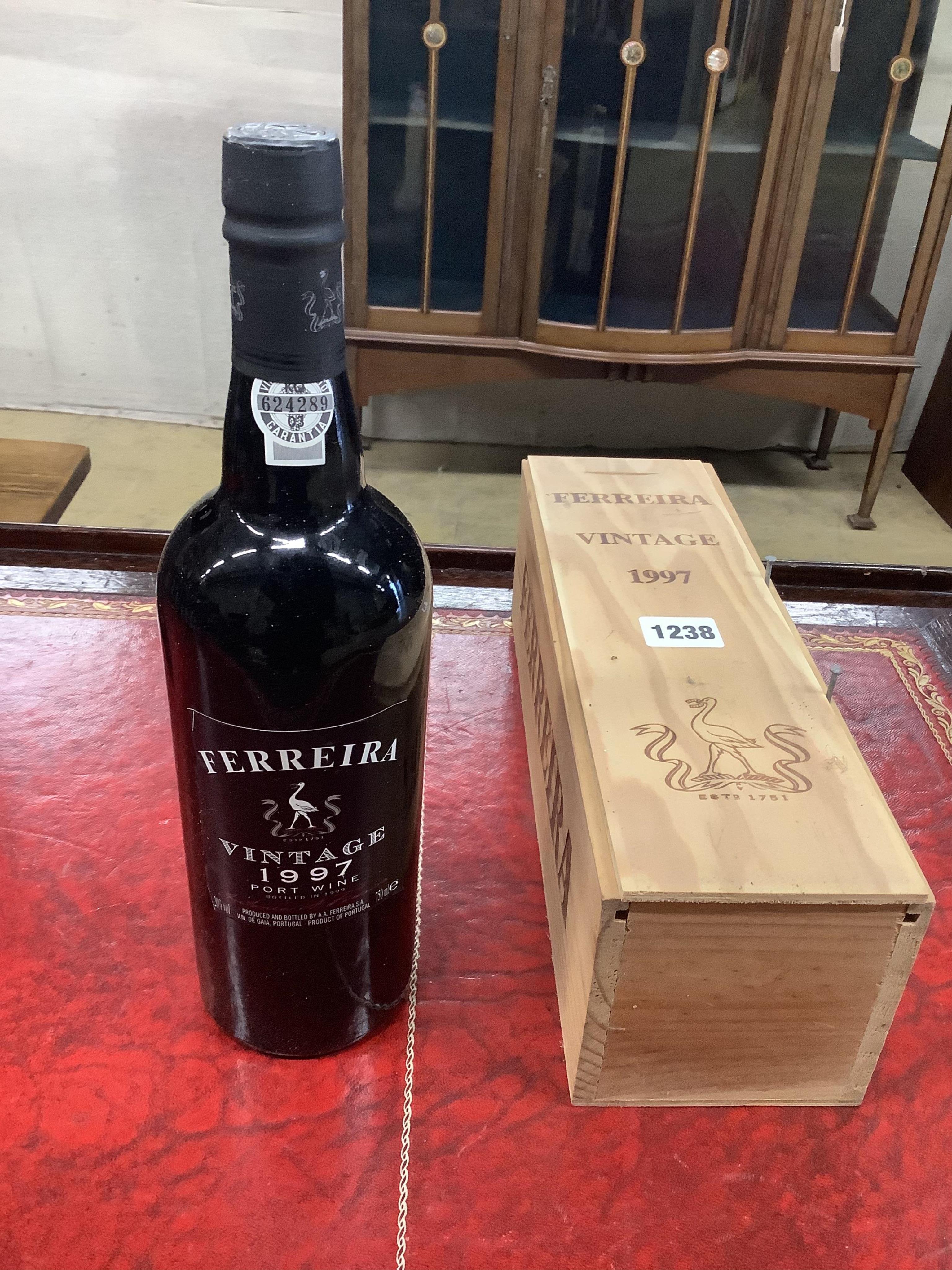 A bottle of Ferreira 1997 Vintage Port, O.W.C. (Surplus stock from a local wedding event company).